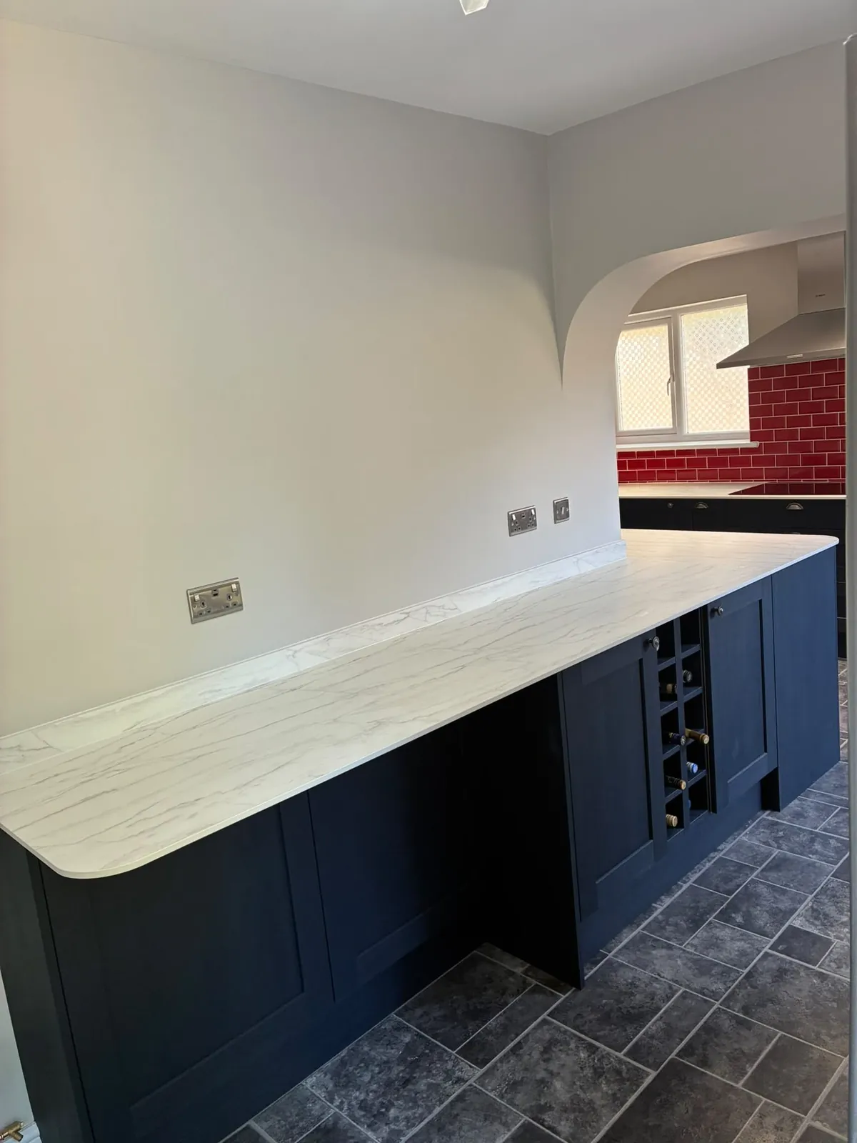 Navy shaker kitchen marble worktop – kitchen fitting by JCK Carpentry & Building, Exeter