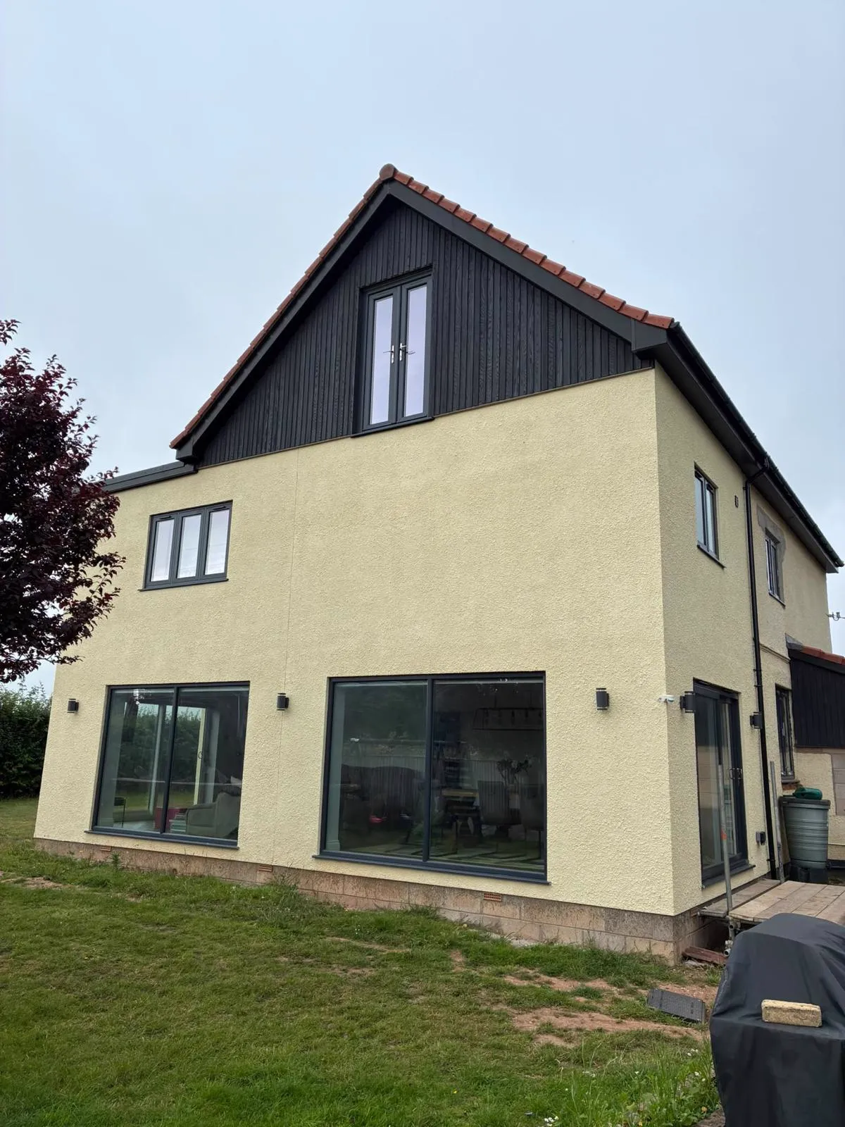 Two-storey rear extension with large glazed doors – extensions by JCK Carpentry & Building, Exeter